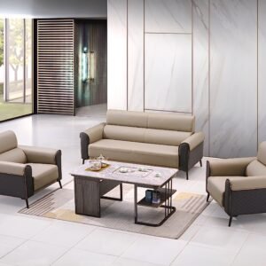 A modern, five-seater sofa set with light beige leather upholstery and dark grey patterned accents, comprising a three-seater sofa and two matching single-seater armchairs, arranged around a contemporary wooden and metal coffee table on a light rug in a spacious, minimalist room.