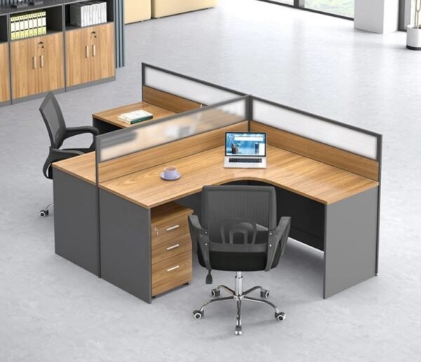 A two-person L-shaped office workstation unit crafted from light wood-toned melamine MDF and dark grey panels, with white and grey privacy partitions, designed for an open office environment.